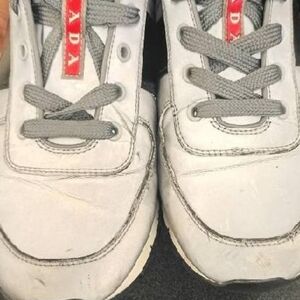 Prada Kids White Sneakers with Gray Laces and Red Logo